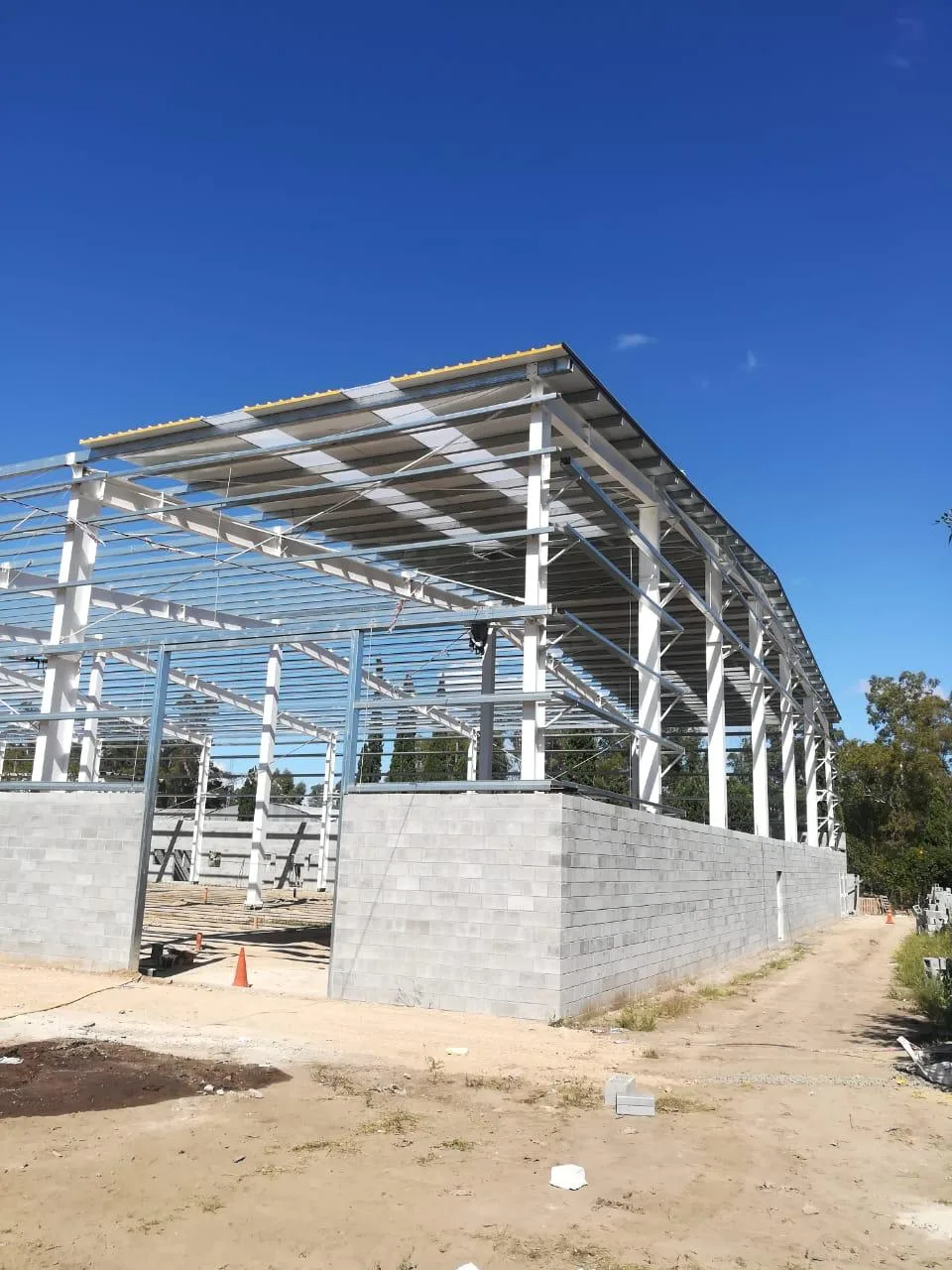 Insulated metal panel installation supervised by Xipre IMP project managers at industrial facility